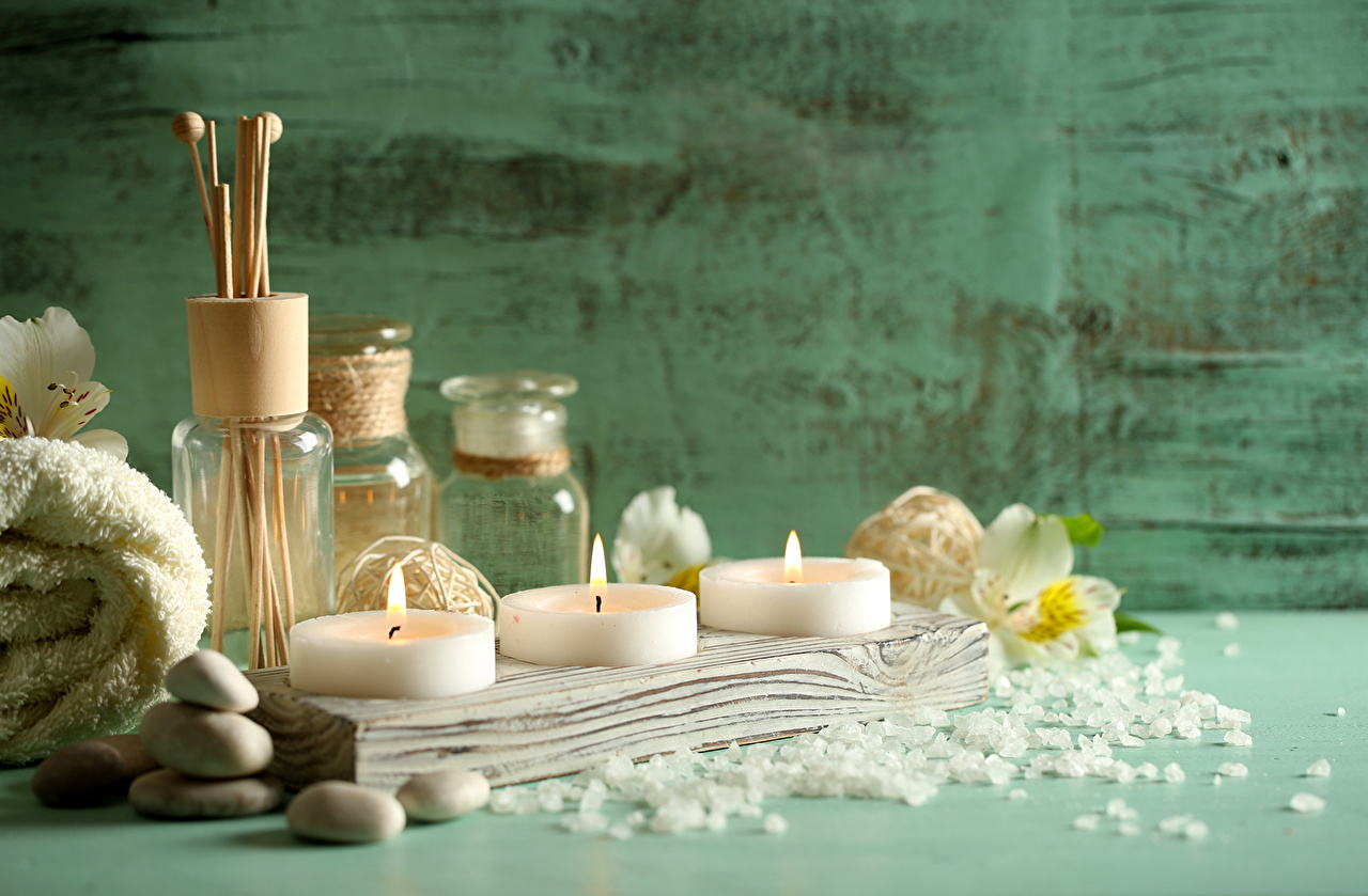 “Luxury spa arrangement with candles, rolled towel, stones, and essential oils at Lotus Men’s Spa in Anantapur — creating a calm, refreshing, and soothing wellness atmosphere.”