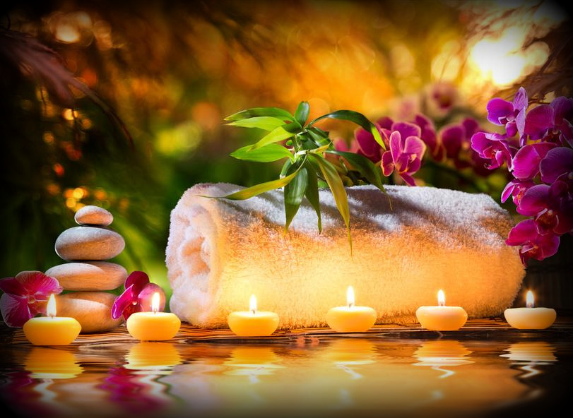 “Luxury spa setup with candles, orchid flowers, smooth stones, and a rolled towel at Lotus Men’s Spa in Anantapur — a peaceful ambiance for men’s relaxation and wellness.”