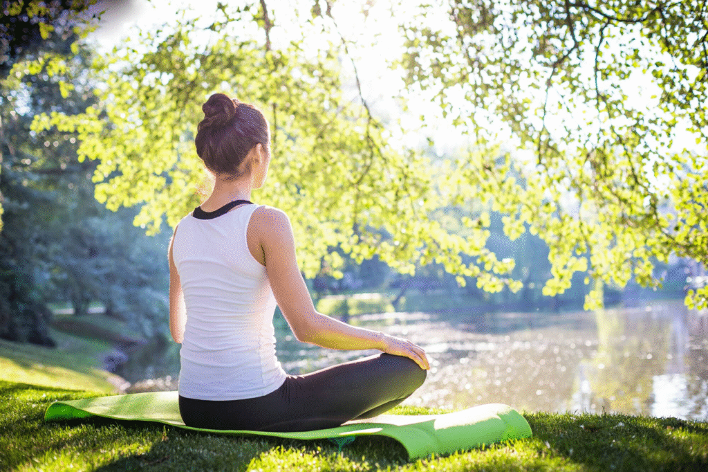 “Person practicing relaxation and mindfulness outdoors to relieve stress and improve well-being, reflecting the calming experience at Men’s Grooming Spa in Anantapur.”